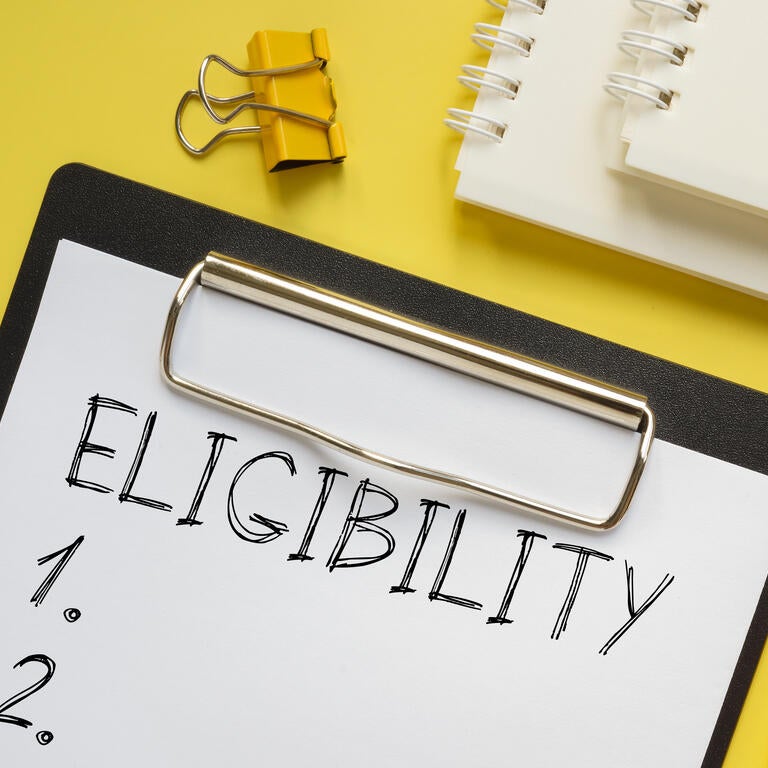 A checklist on a clipboard with "Eligibility" written across the top