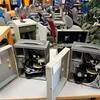 Microscopes in metal cases.